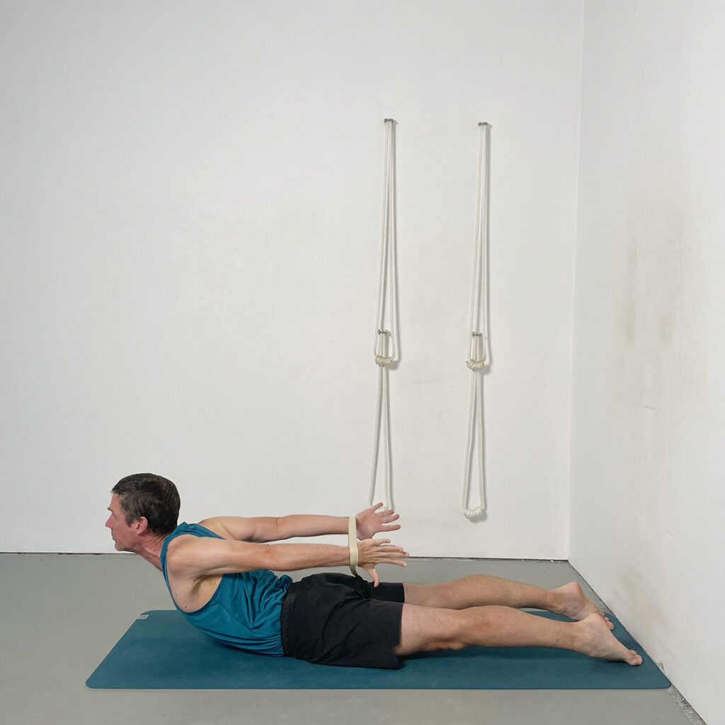 shalabhasana with belt