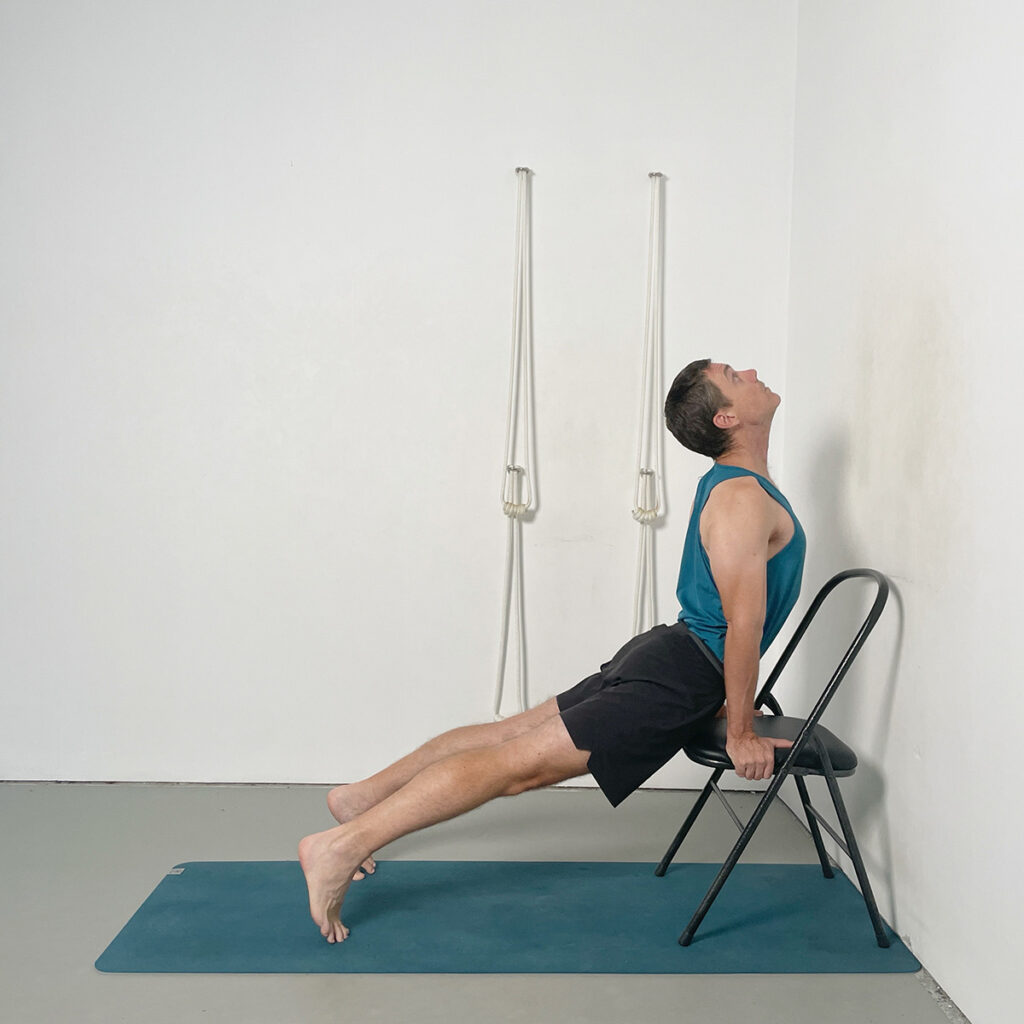 upward facing dog pose using a chair