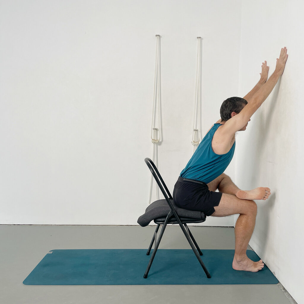 7. Chair-Supported Pigeon Pose (Piriformis Stretch)