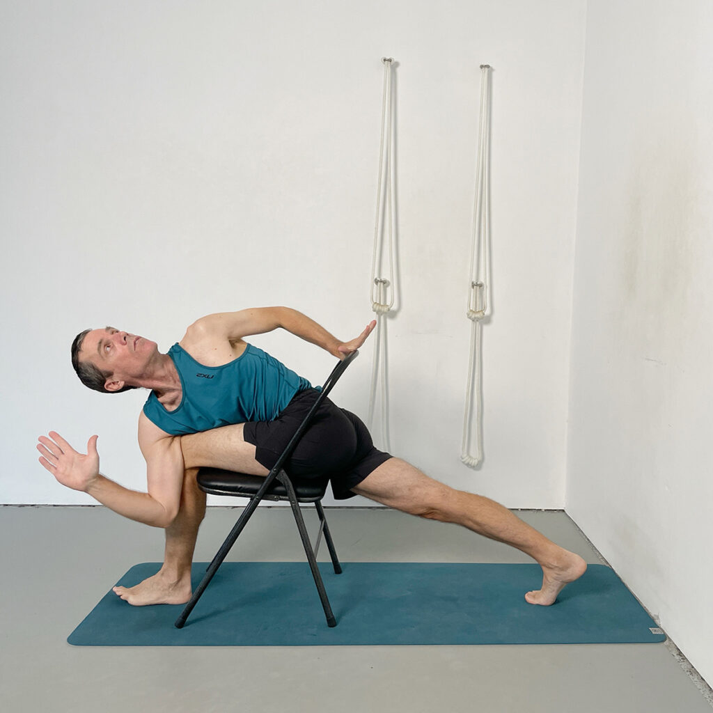Parivrtta Parsvakonasana (Revolved Side Angle Pose) with Chair Support