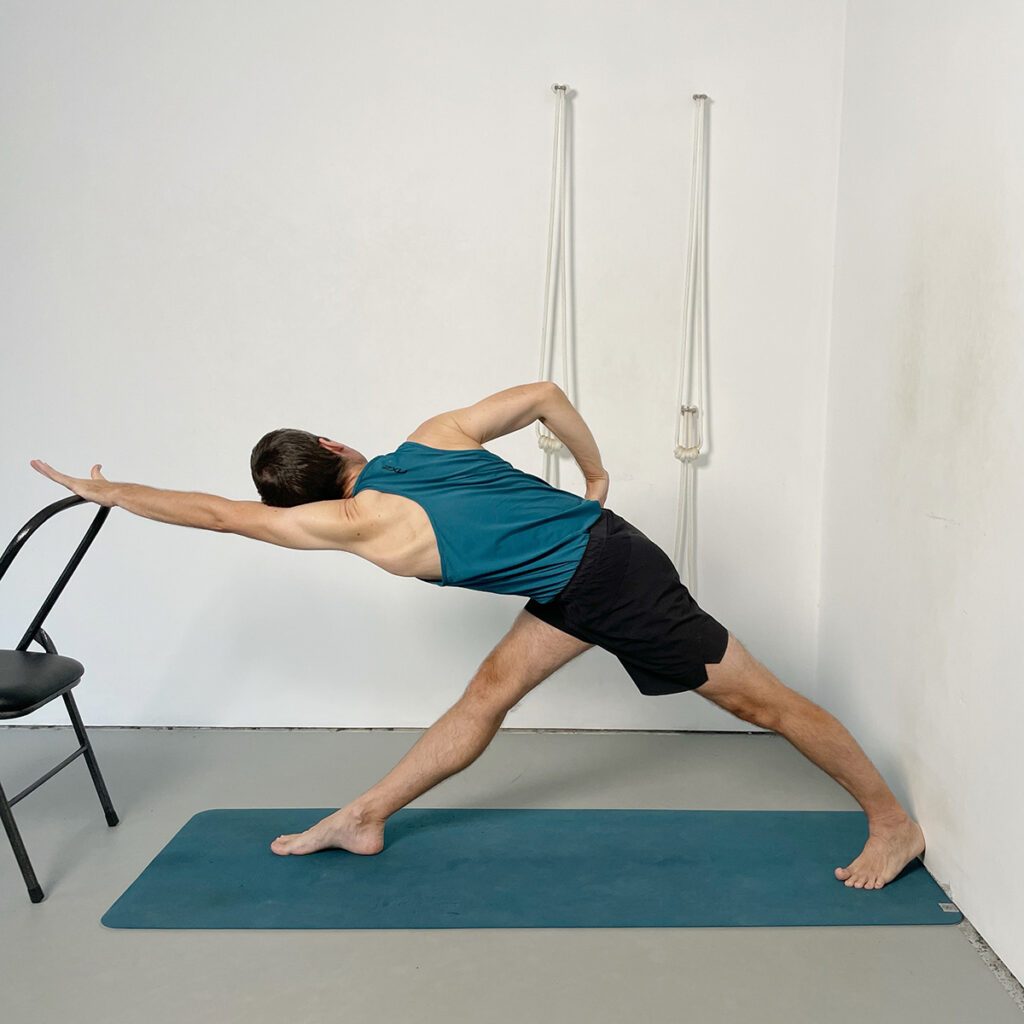 Parivrtta Trikonasana (Revolved Triangle Pose) with Chair Support