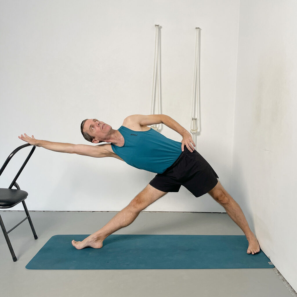 Trikonasana (Triangle Pose) with Chair Support