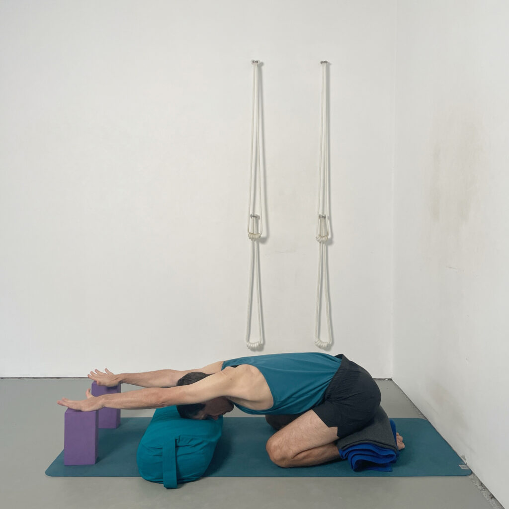 adho mukha virasana with supports
