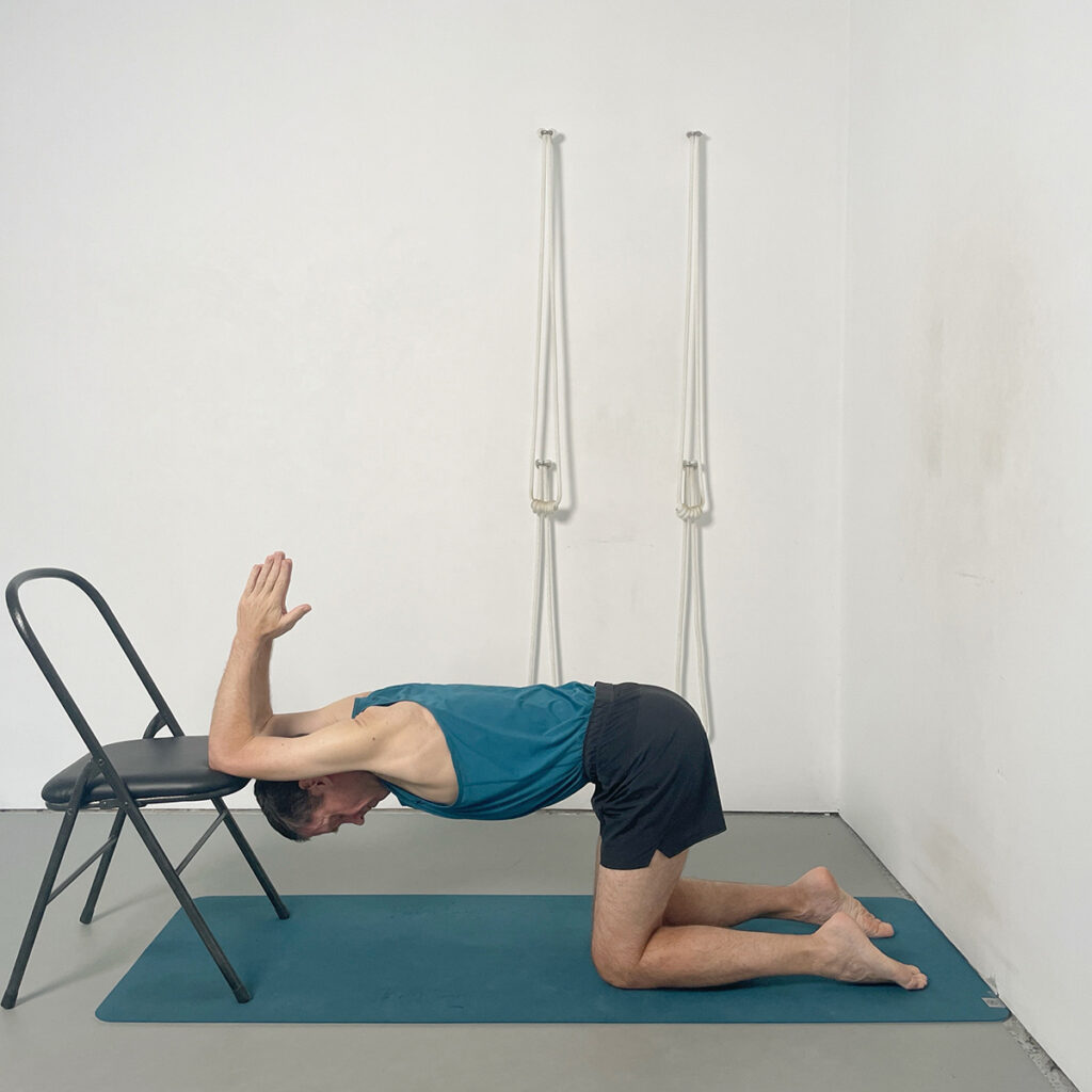 Headstand preparation with chair